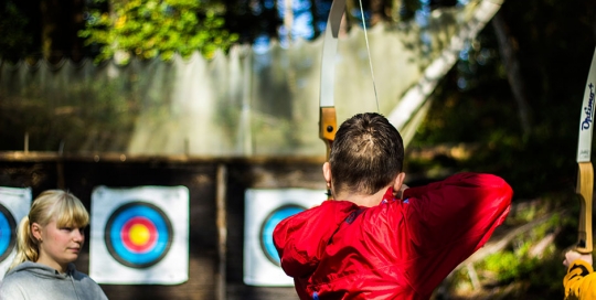 Trying out a range of activities - here, archery