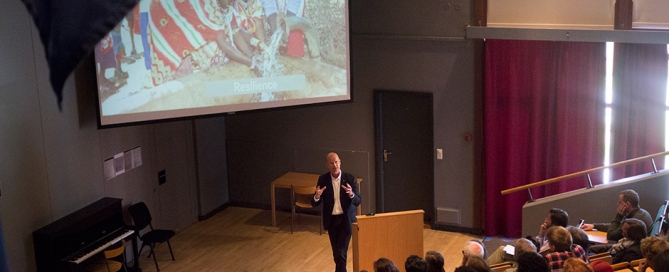 Sven Mollekleiv addressing staff, students and guests in the auditorium