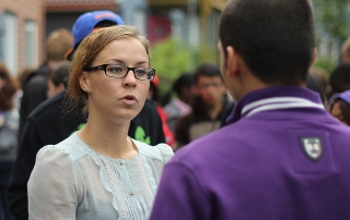 Susanne Gabrielsen talking to one of the students during a visit to the College