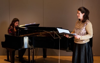 During the recital. Christina on piano, Aileen singing.