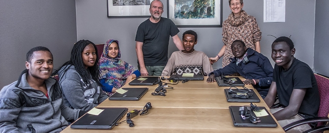 Students receiving laptops