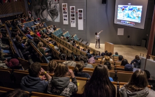 Karen O'Brien presenting in the auditorium