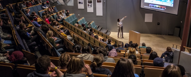 Karen O'Brien presenting in the auditorium